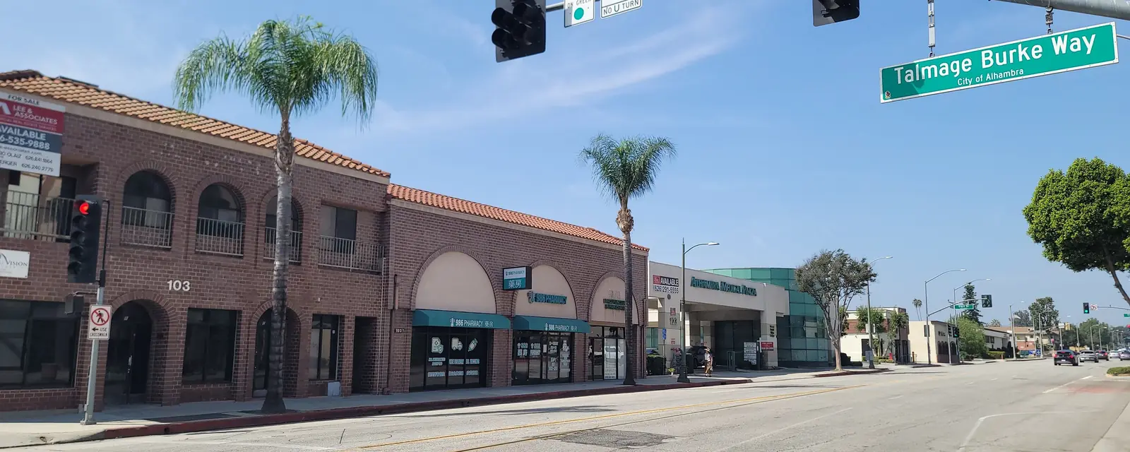 Brick arcade buildings with small offices and shops at Talmage Burke Way, Alhambra