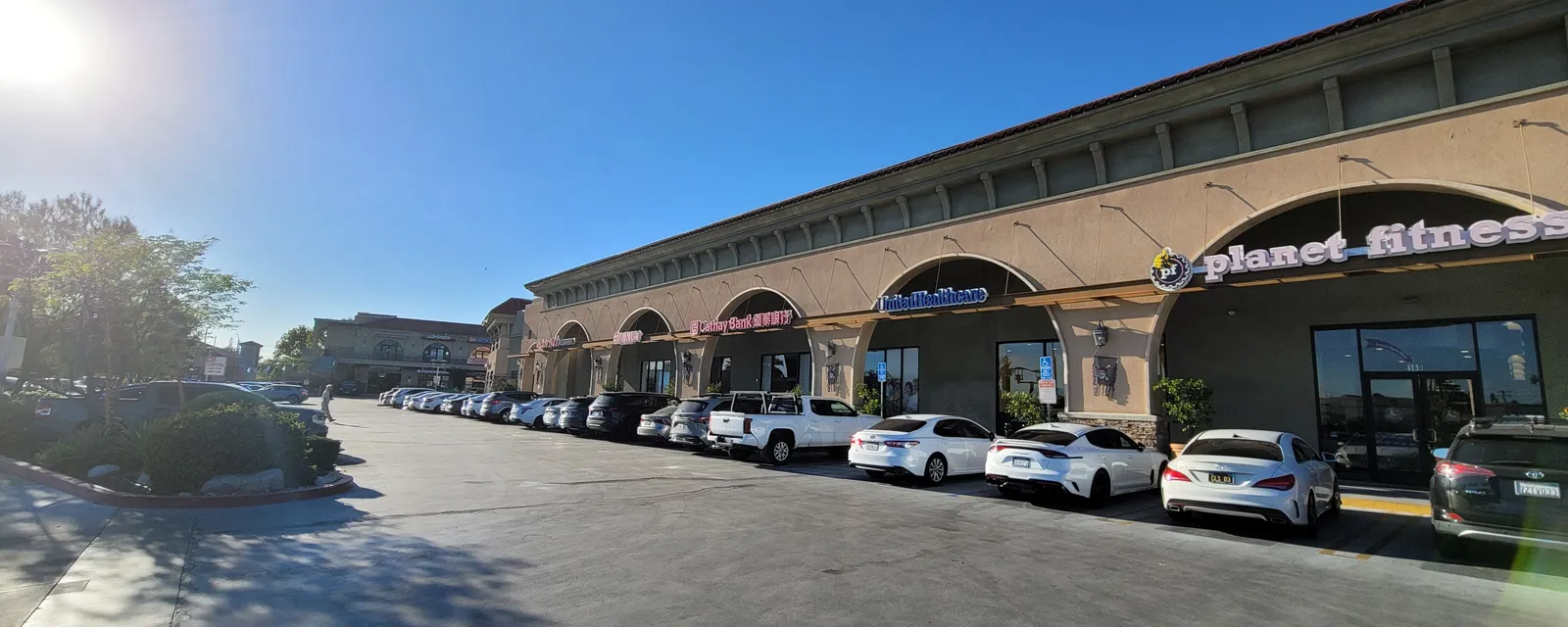 A row of shops under arched arcades in a Temple City plaza